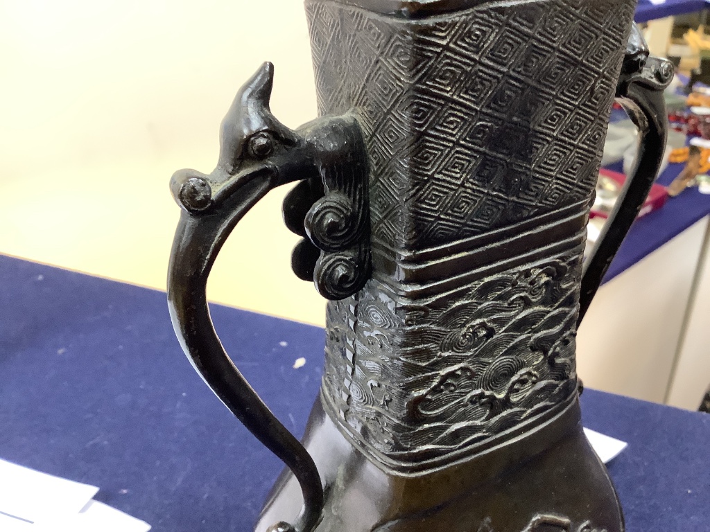 A Chinese bronze two handled flower vase, Ming dynasty, 24.5cm